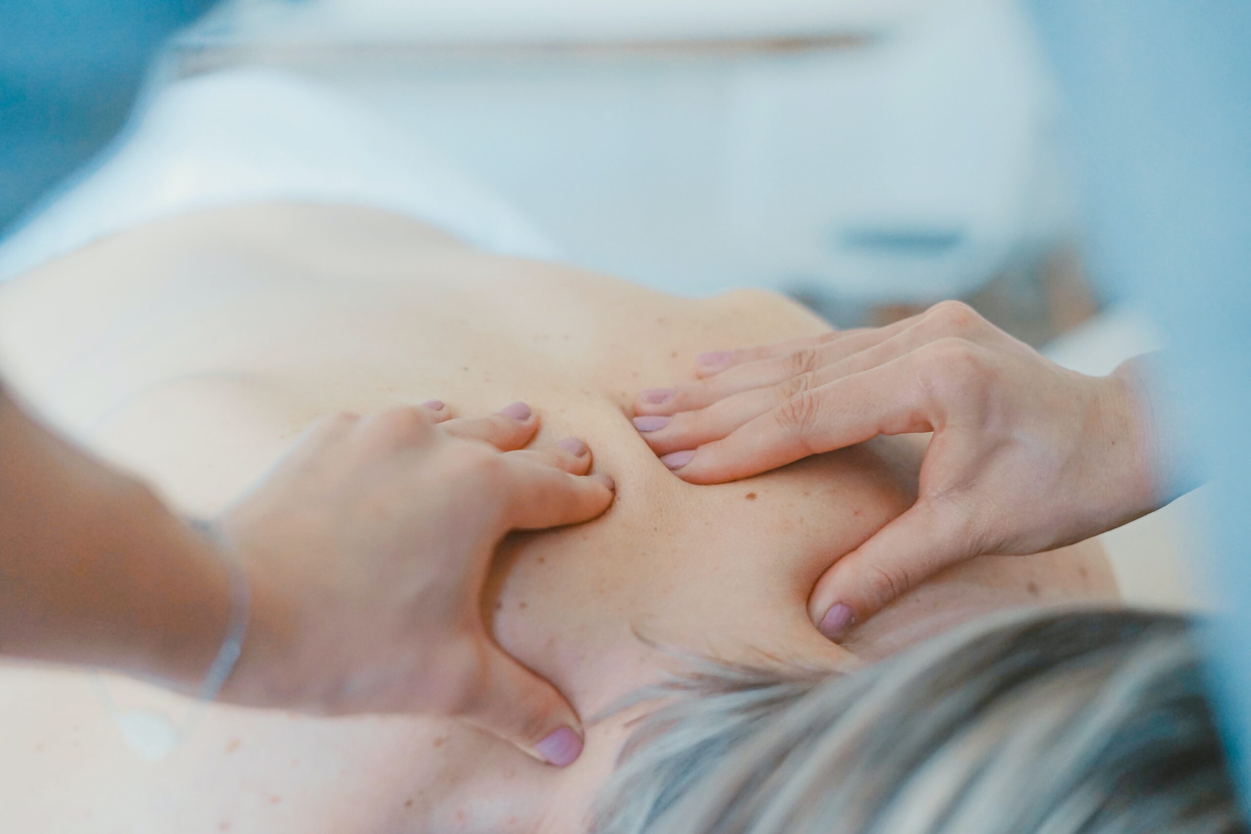 a person receiving a back massage