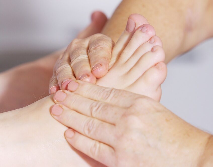 A woman receiving plantar fasciitis treatment