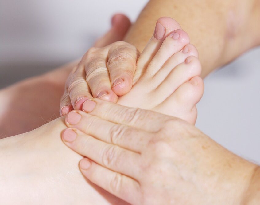 A woman receiving plantar fasciitis treatment